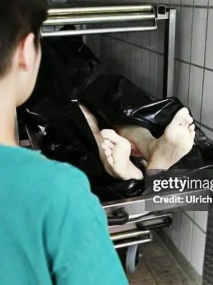 Nude feet of corpse in morgue