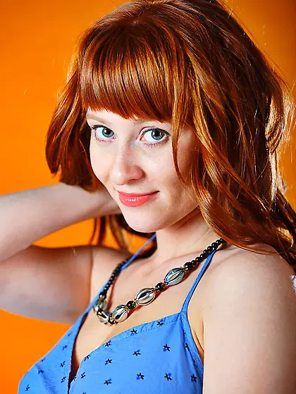 Gorgeous young redhead Polina Nubiles slips out of her lingerie