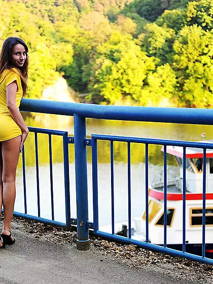 Leggy teen temptress Inna Blossom in short yellow dress demonstr