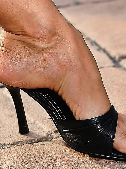 Anita Dark takes all of her clothes off outdoors and teases us w