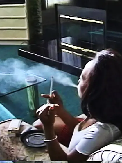 Fine black lady sits