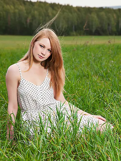 Fooling around in the green meadow this cutie Anett A is exposin