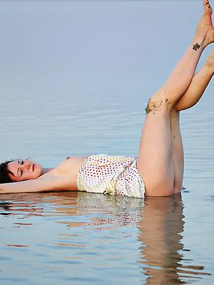 Perfect-bodied brunette exploring the water and showing her smal