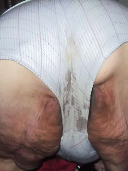 Leaned over in cut-offs and flashing rump