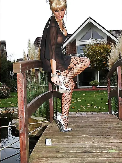 Huge-Boobed mummy in fishnets and gash weights