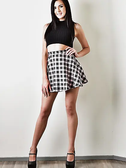 Attractive solo chick takes off skirt and panties to tease with