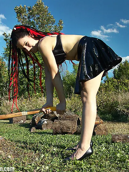 Brunette slut playing with ax while nude