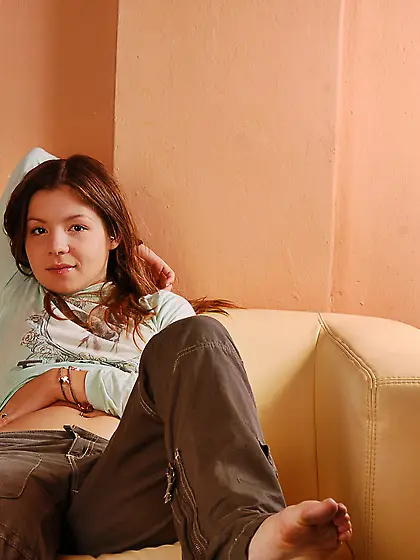 Seductive teen cuttie Emily 18 strips her red thongs on the sofa