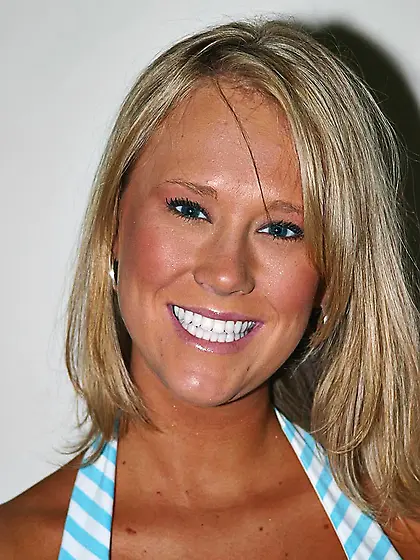 Curvy tanned blonde Carly Kaleb with huge tits and shaved twat w