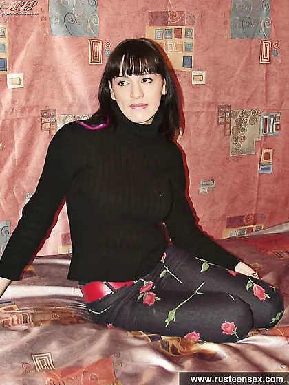 Russian teen brunette shows her naked body