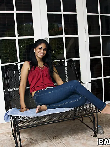 One Latina chick named Gypsy plays next to the swimming pool