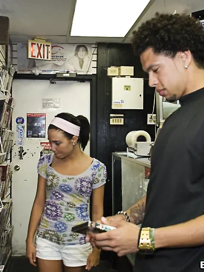 Brandi Belle takes her clothes off in the video store and shows