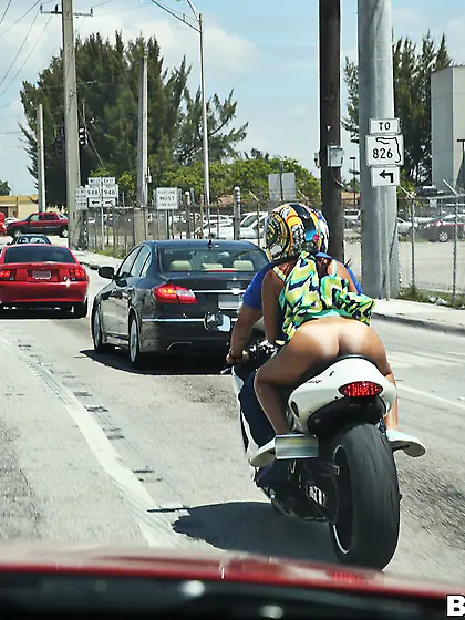 Big booty auburn-haired hottie fucked next to a fancy motorcycle