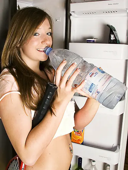 Sporty chick Cate Harrington gets naked and spreads her pussy li