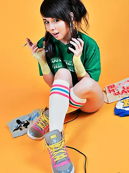 Disobedient girl,  Ariel Rebel,  smokes a cigarette and listens to