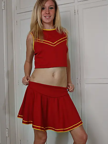 Blonde Allison Pierce in red cheerleader uniform and white panti