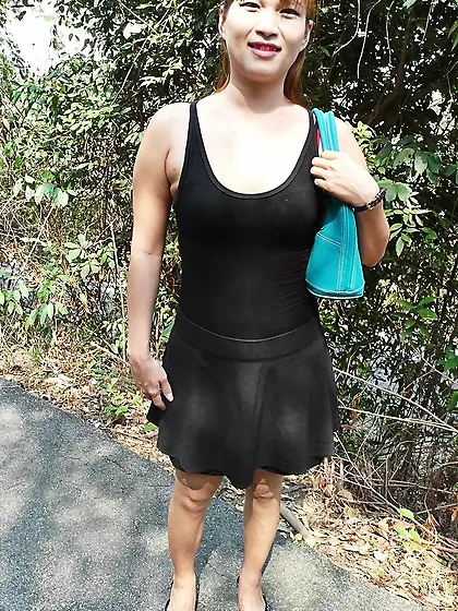 Modest Thai girl takes off black dress and welcomes cock inside