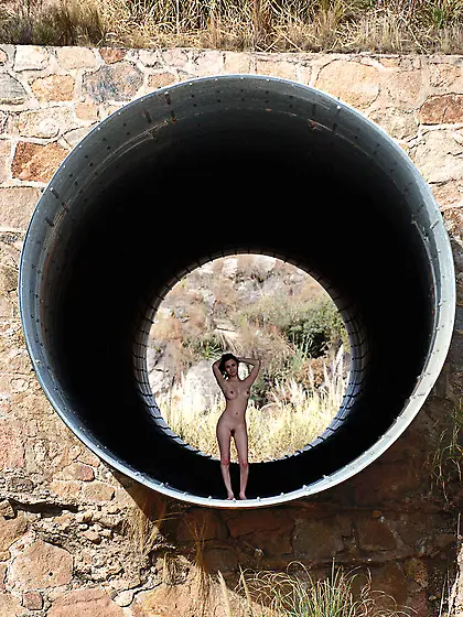 Alluring brunette model Lara MetArt strips outdoors and shows us