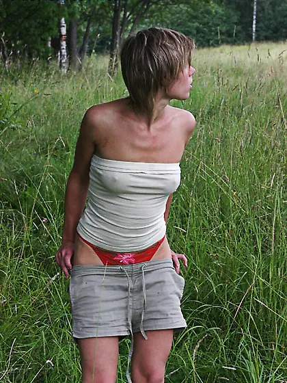 Cute teen peeing in the park