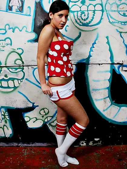 Pigtailed teen with low lip piercing isn't afraid of demonstrati