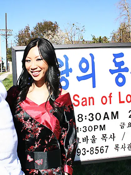 Dark haired Asiatic darling sucks a giant black dong and gets a