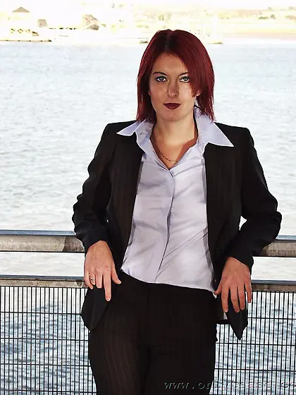 Bad redhead girl Rosie takes off her suit and shamelessly displa