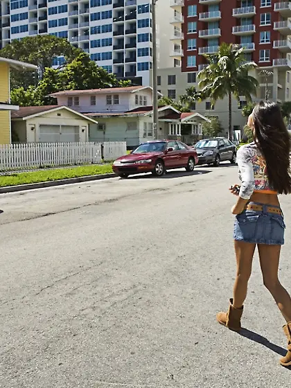 Paola Rey takes her tight denim shorts off in front of the camer