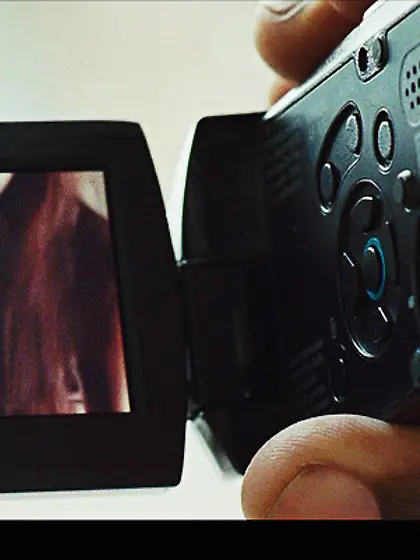 Two cute and nerdy brunettes are kissing...