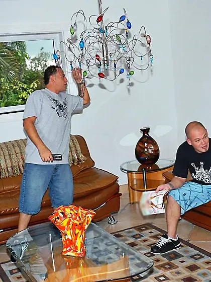 Two ebony beauties with leather cop hats getting fucked together