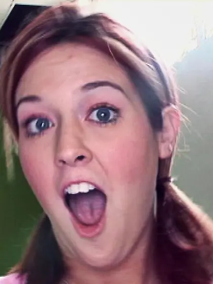 Pigtailed teen riding black