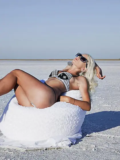 Enchanting blonde babe Nika N removes her lingerie outdoors and