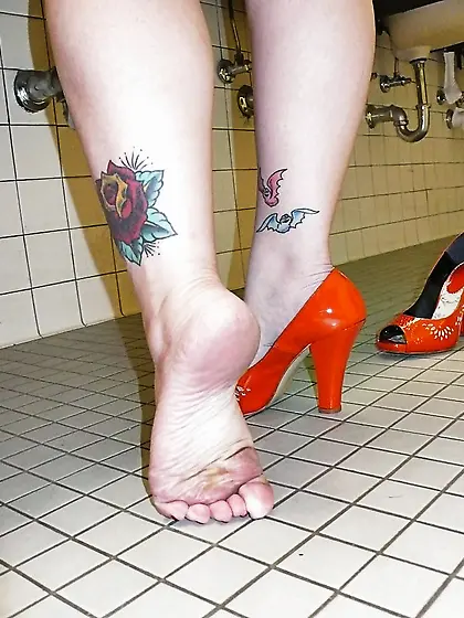 April washes her feet in the ladys room