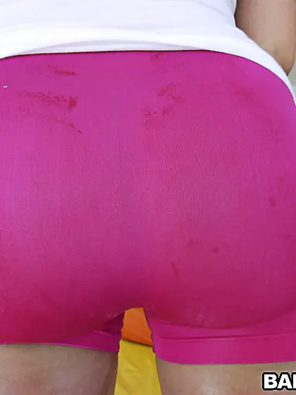 Kelly Divine takes her cute shorts off and then shows her oiled