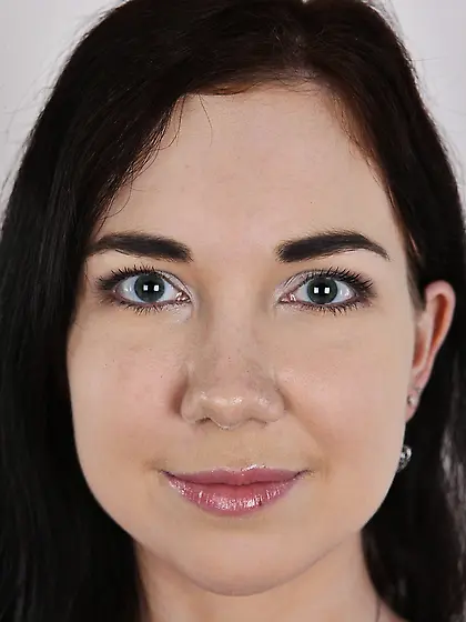 Adorable brunette with long hair demonstrates perky boobs and no