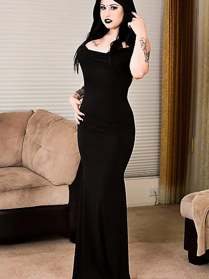 Stunning goth Ophellia Rain displays her big tits after undressi