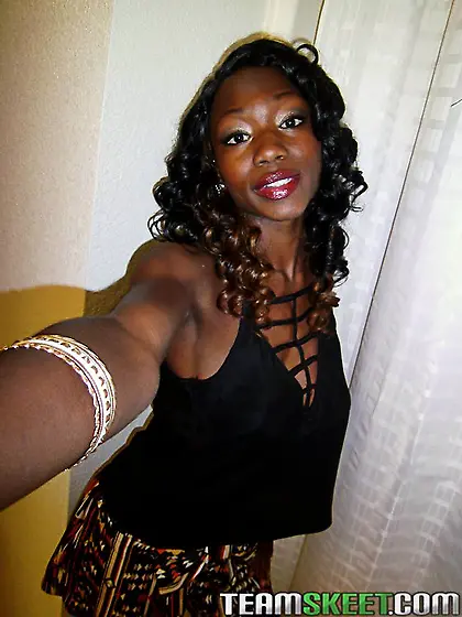 Horny ebony takes pics of her big round boobs to attract dicks