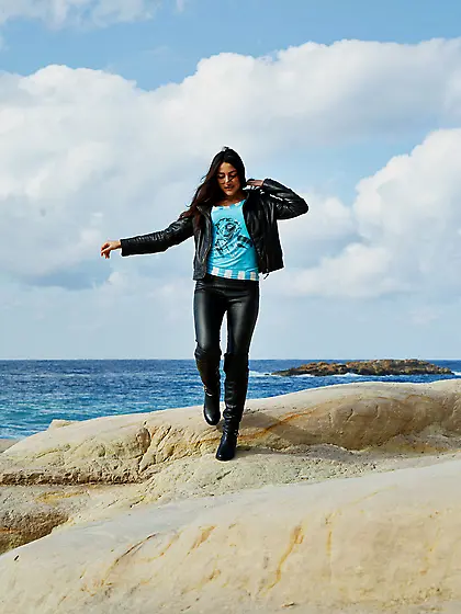 Pink get-up brunette lifts up her skirt and shows her naked body