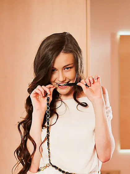 Busty wavy-haired beauty lifts up her skirt to make her intentio