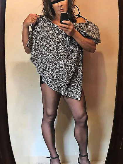 In heels and pantyhose