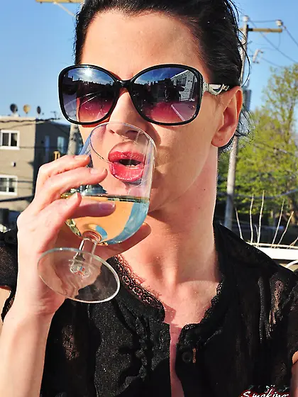 Redhead Mina in shades smoking frenzy drinking wine