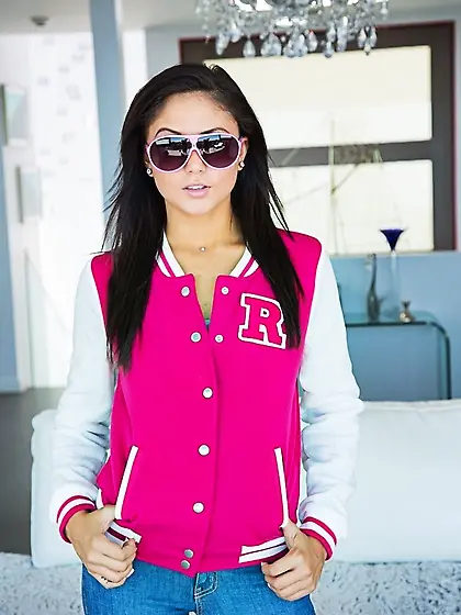 Sexy schoolgirl takes off her varsity jacket after a blowjob to