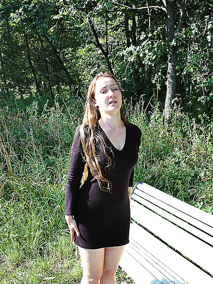 Teen blonde pissing outdoor on the bench in a park