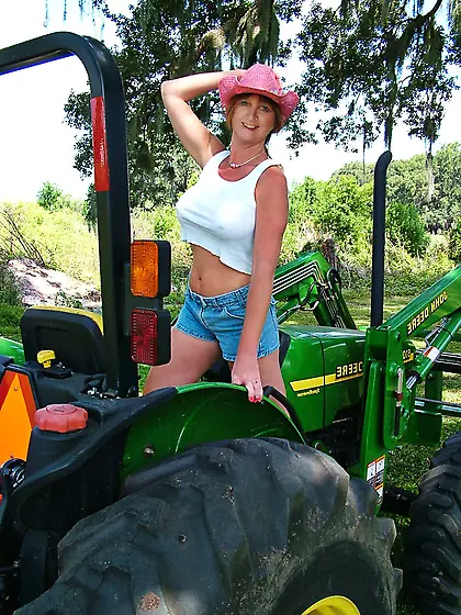 Mature wifey displaying on a farm.