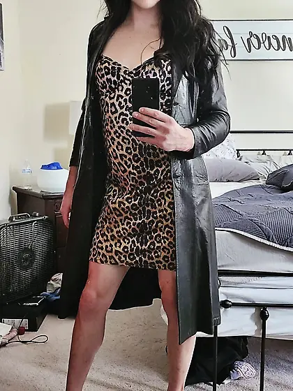Crossdresser in leather coat and heels
