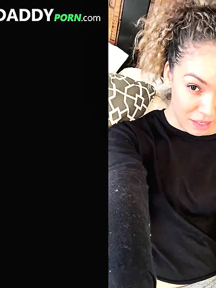 Curly-haired dame collects cum on her chest