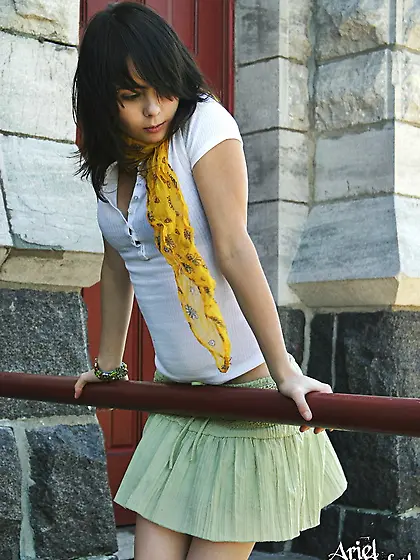 Ariel Rebel uses a silky scarf to caress her tummy and even her