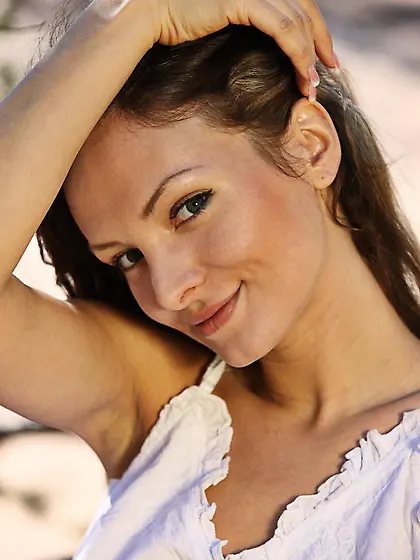 Brunette girl Zhanet A is naked on the ground moving sexily and