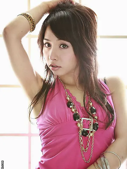 Cute Asian chick Tomoe Hinatsu is teasing with the smooth skin o