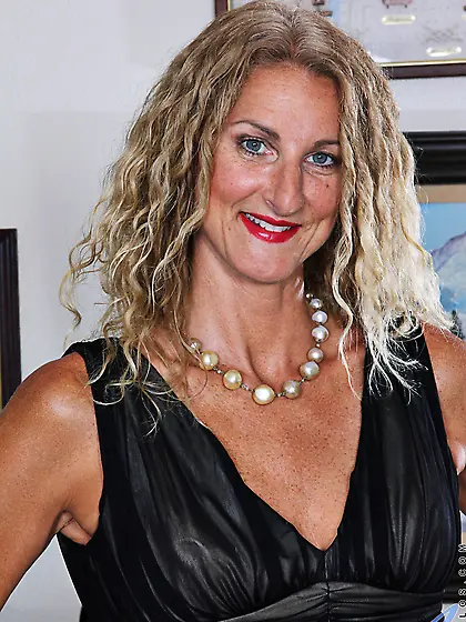 Female in black dress and red high heels exposes her body with t