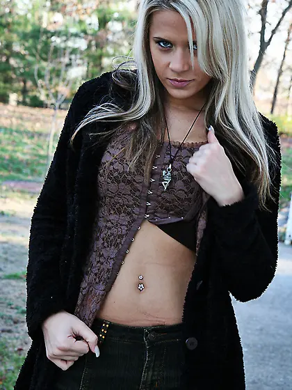 Ann Angel takes all of her clothes outdoors and teases us with h